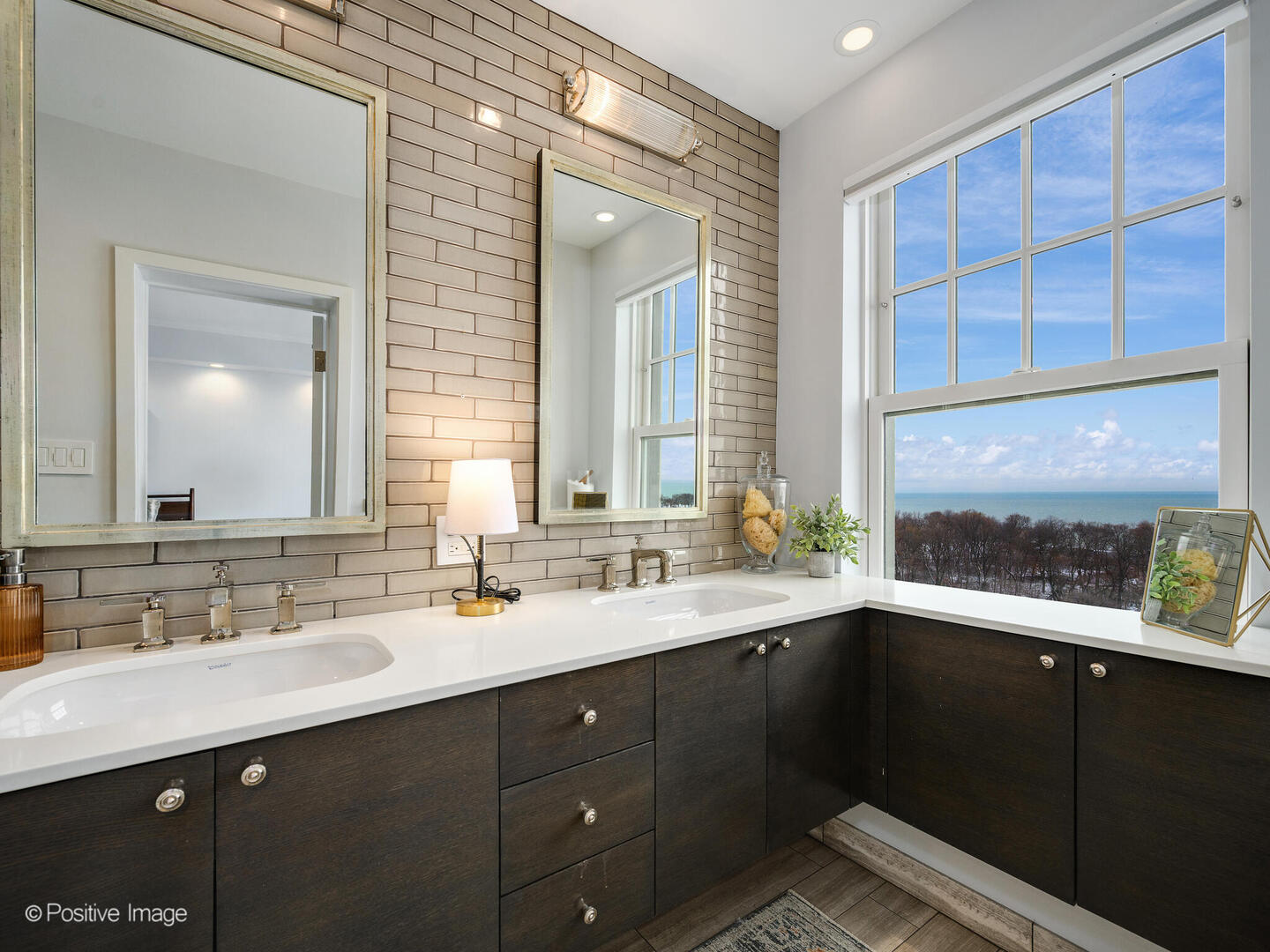3530 North Lake Shore Drive, Unit 11B Chicago, IL 60657 - Photo 19 of 24 a bathroom with a double vanity sink and a mirror