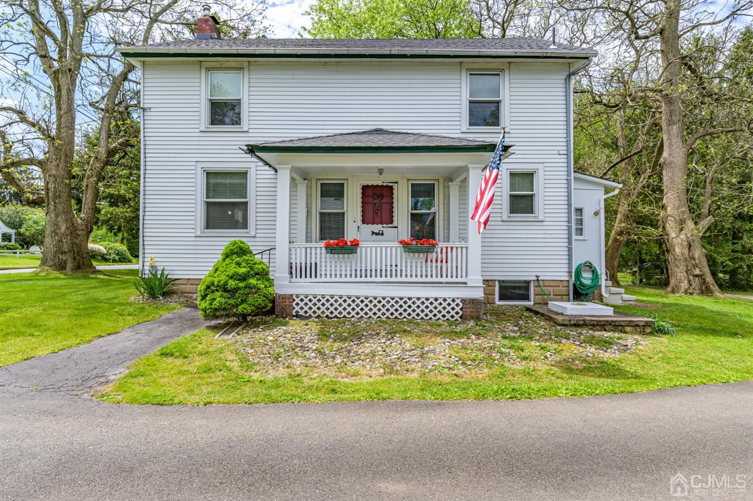 1237 Lower Ferry Road Ewing, NJ 08618 - Photo 1 of 42 a front view of a house with a yard table and chairs