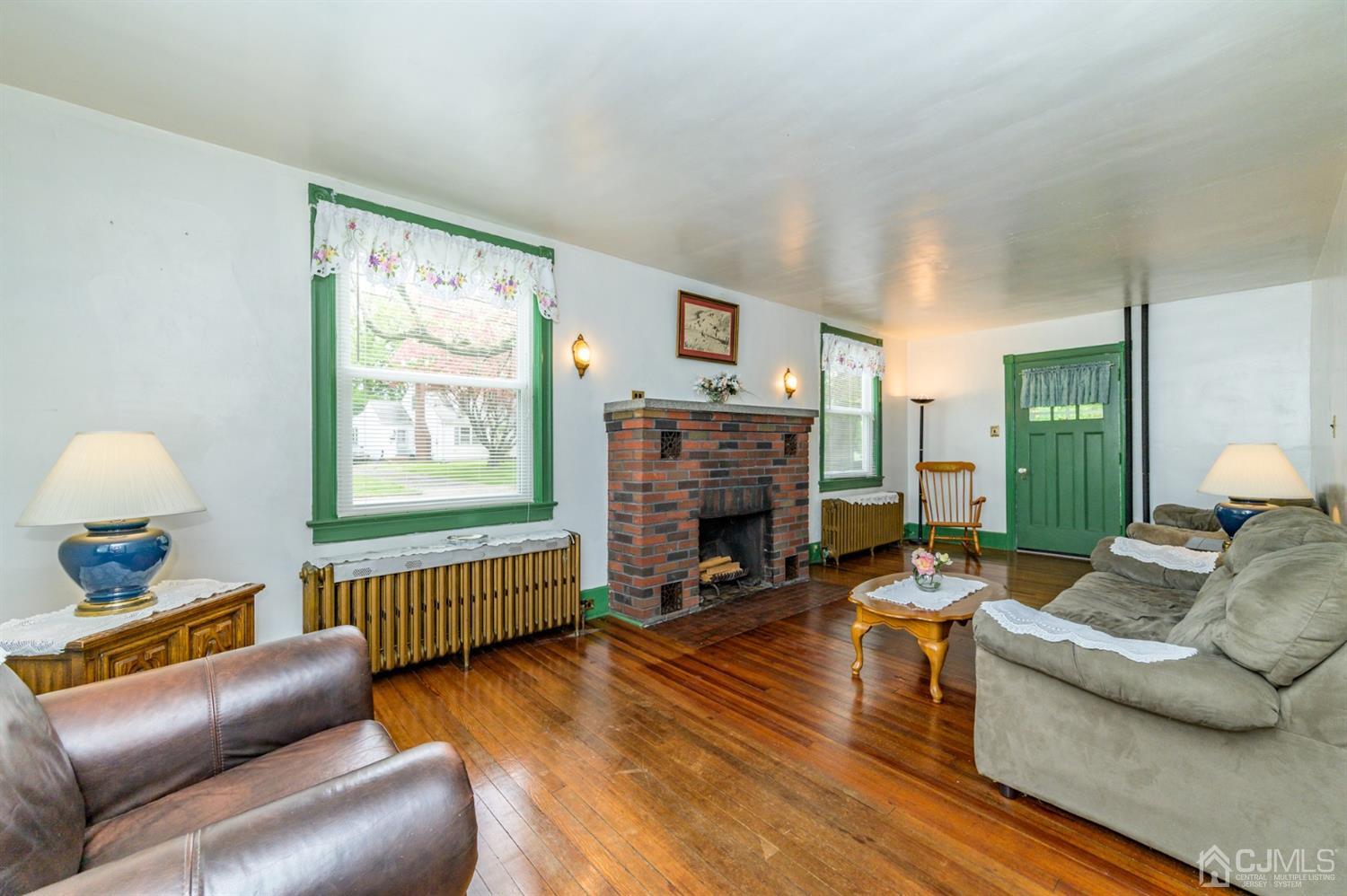 1237 Lower Ferry Road Ewing, NJ 08618 - Photo 11 of 42 a living room with furniture and a fireplace