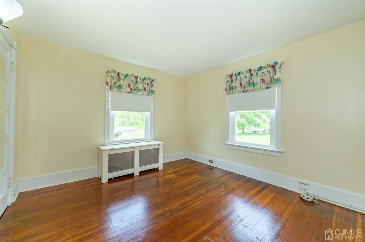 1237 Lower Ferry Road Ewing, NJ 08618 - Photo 14 of 42 a view of a livingroom with wooden floor and a window