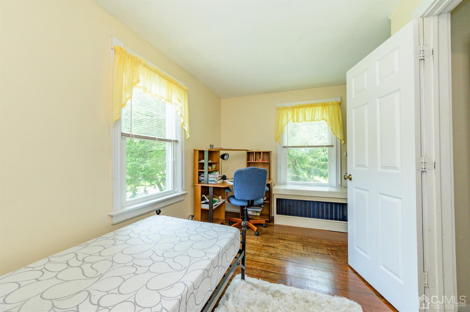 1237 Lower Ferry Road Ewing, NJ 08618 - Photo 16 of 42 a room with a bed and a window