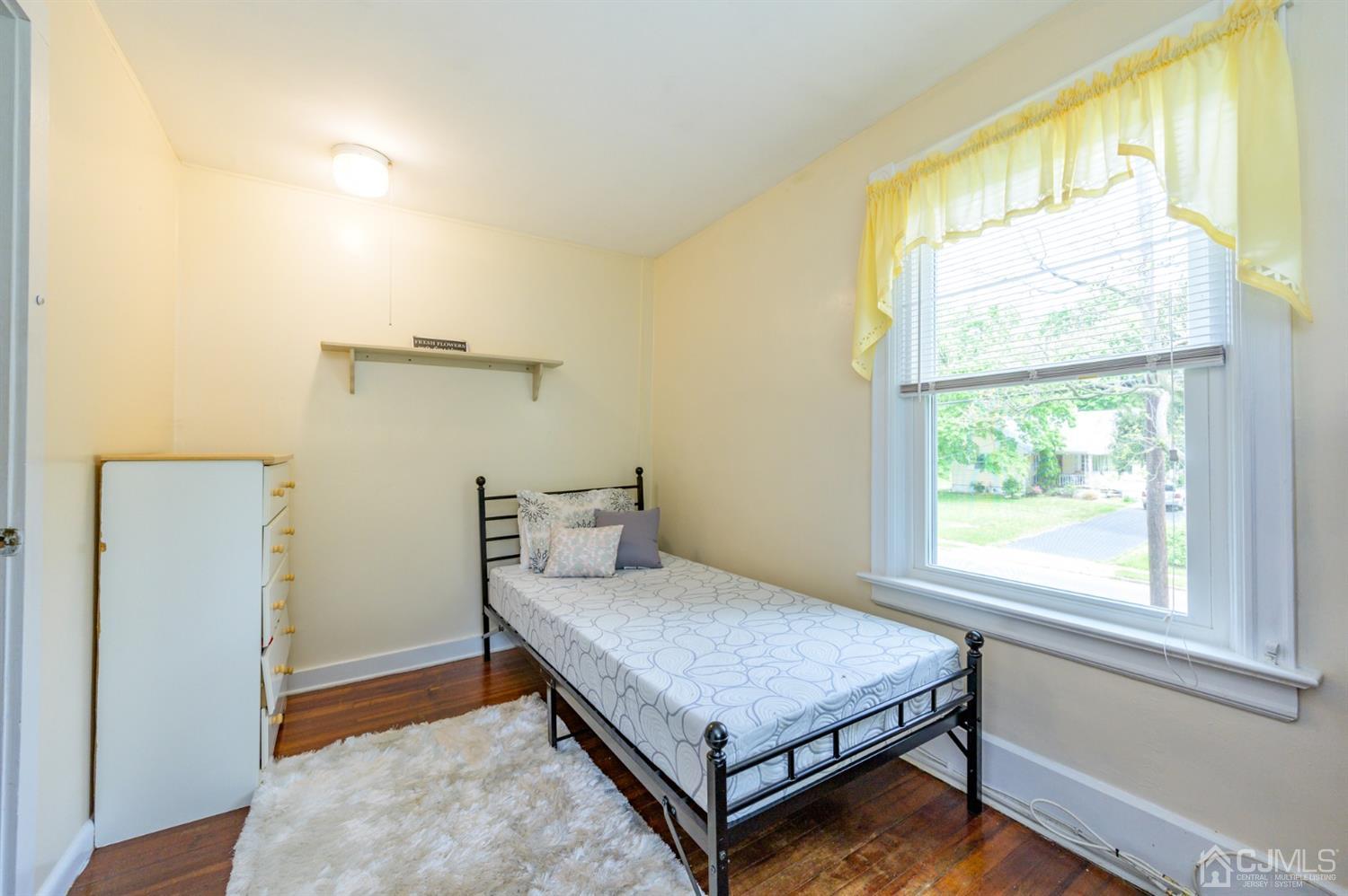 1237 Lower Ferry Road Ewing, NJ 08618 - Photo 17 of 42 a bedroom with a bed and a window