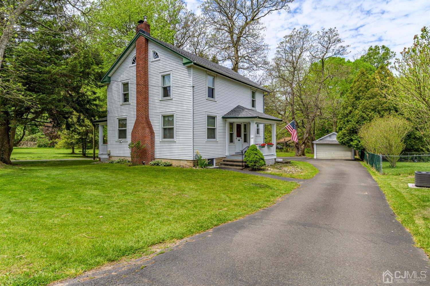 1237 Lower Ferry Road Ewing, NJ 08618 - Photo 24 of 42 a front view of house with yard and green space