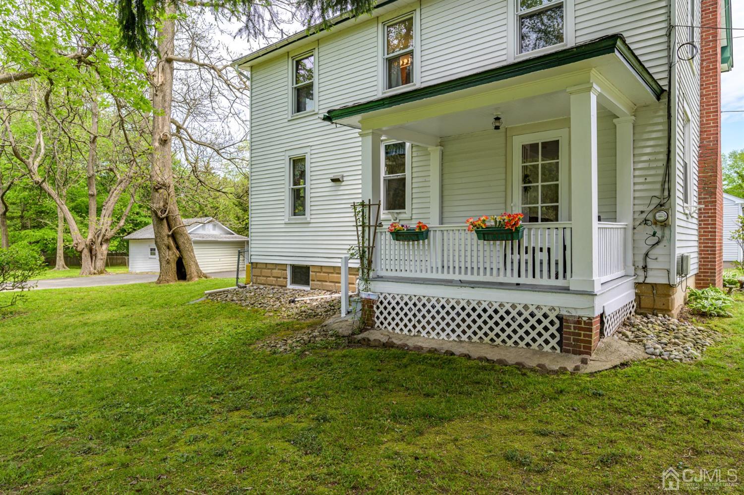 1237 Lower Ferry Road Ewing, NJ 08618 - Photo 25 of 42 a front view of a house with a garden