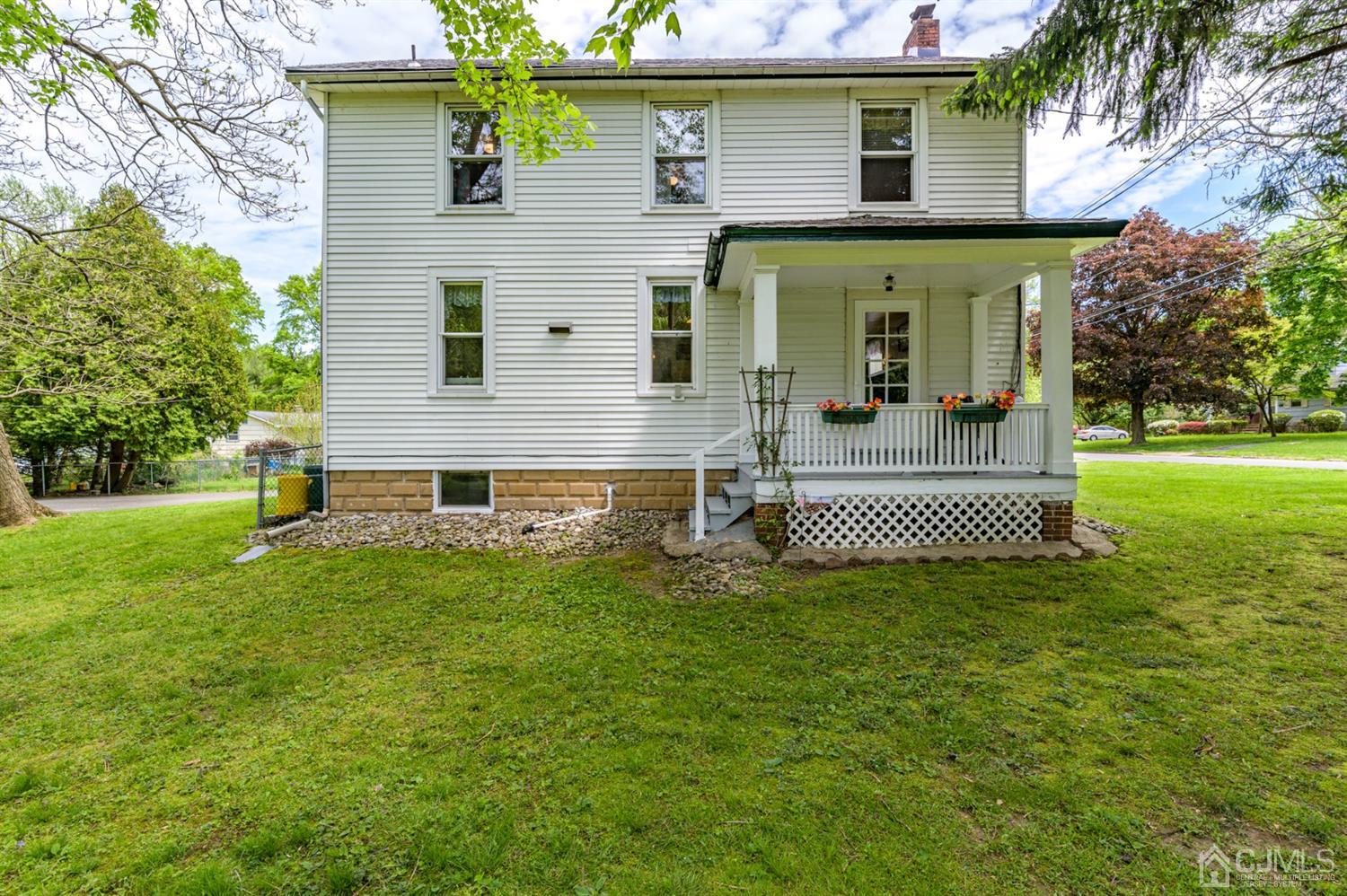 1237 Lower Ferry Road Ewing, NJ 08618 - Photo 26 of 42 a front view of a house with a garden