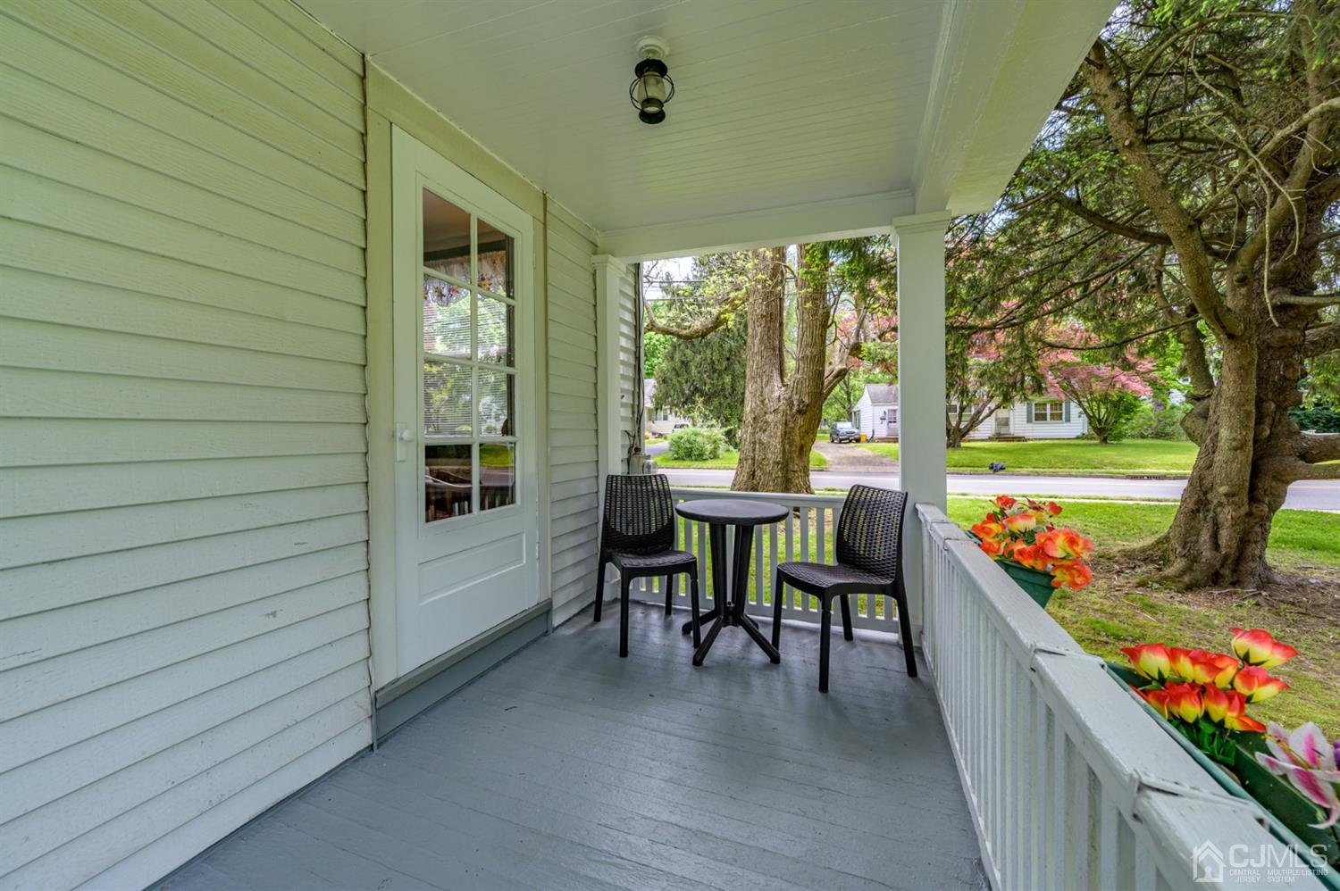1237 Lower Ferry Road Ewing, NJ 08618 - Photo 27 of 42 a view of a patio with a dining table and chairs