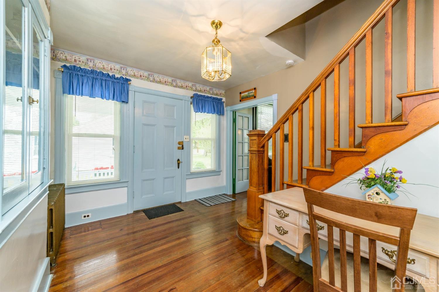 1237 Lower Ferry Road Ewing, NJ 08618 - Photo 4 of 42 a view of an entryway wooden floor and chandelier