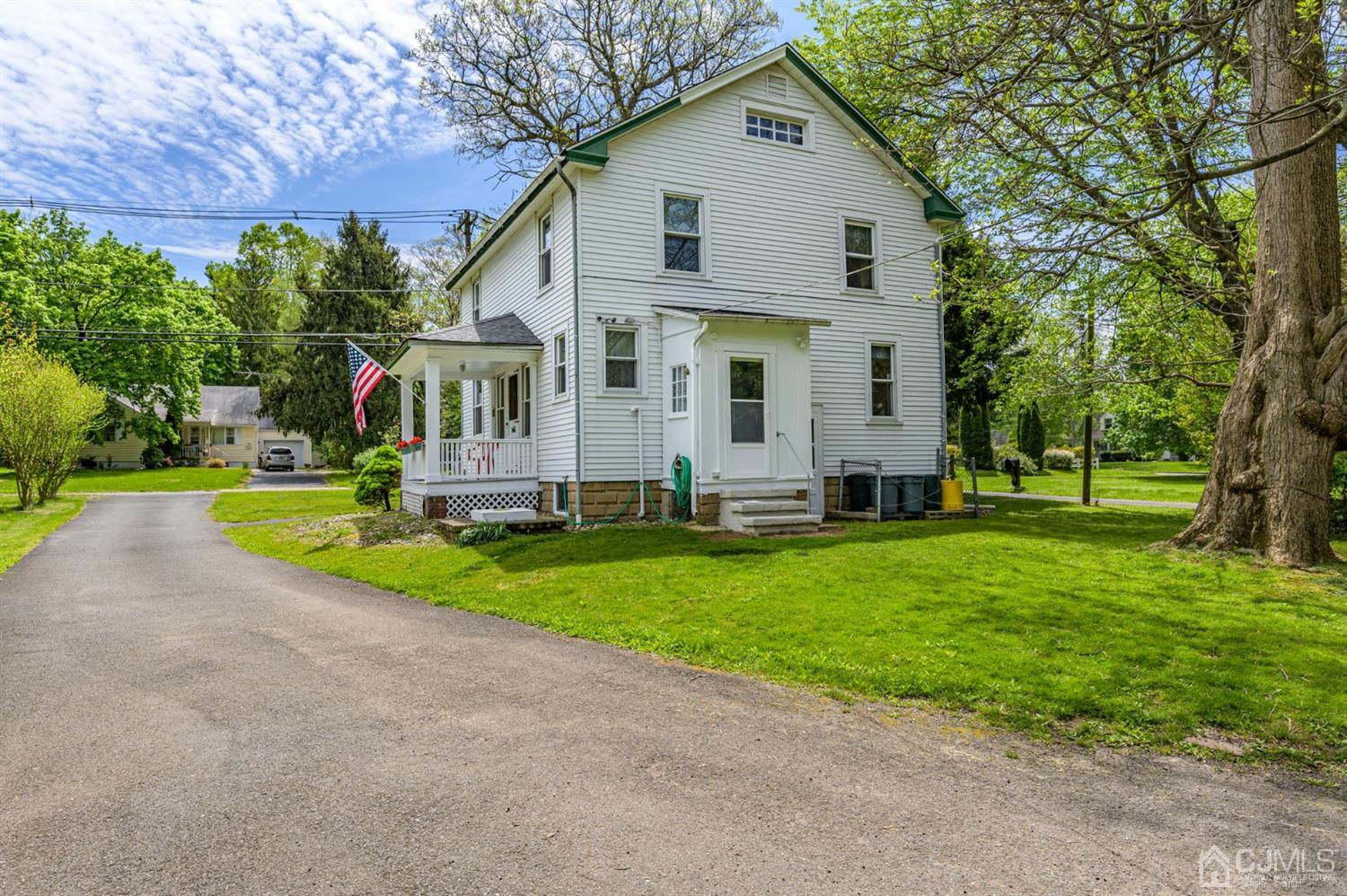 1237 Lower Ferry Road Ewing, NJ 08618 - Photo 31 of 42 a front view of house with yard and green space