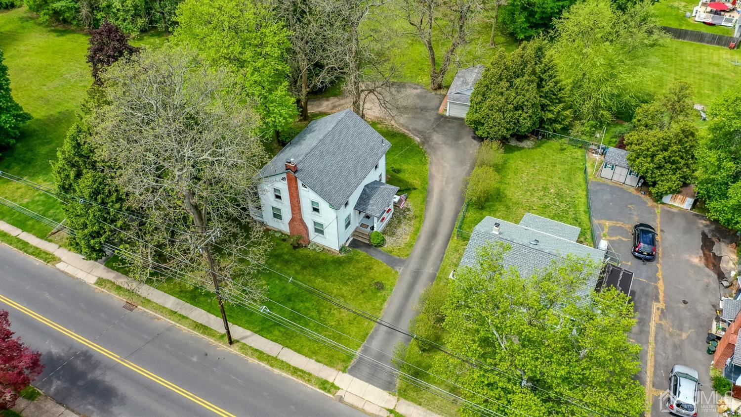1237 Lower Ferry Road Ewing, NJ 08618 - Photo 33 of 42 an aerial view of a house with a yard and tennis court