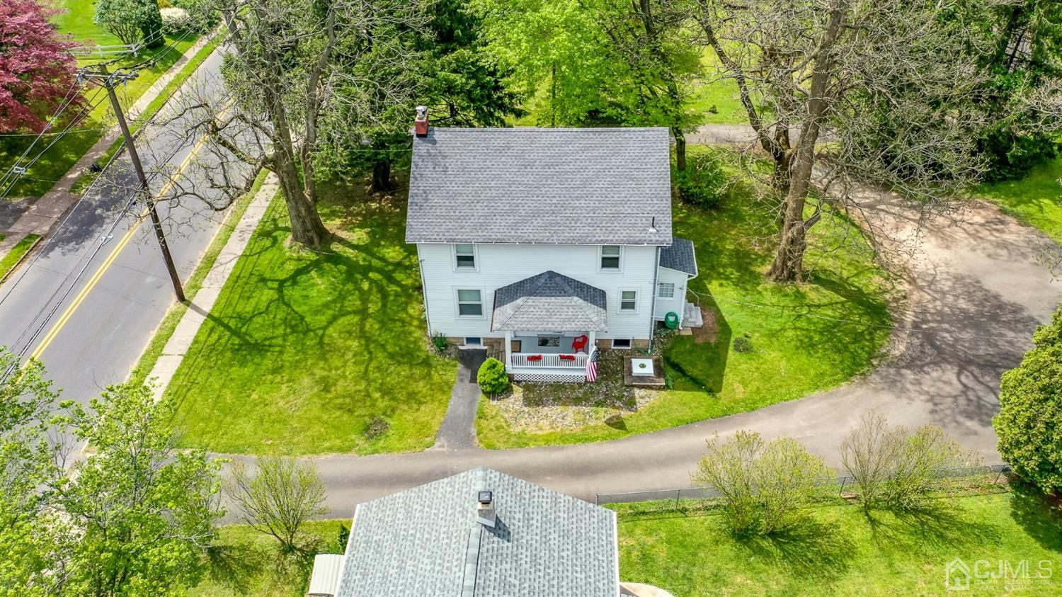 1237 Lower Ferry Road Ewing, NJ 08618 - Photo 34 of 42 an aerial view of a house with swimming pool and large trees