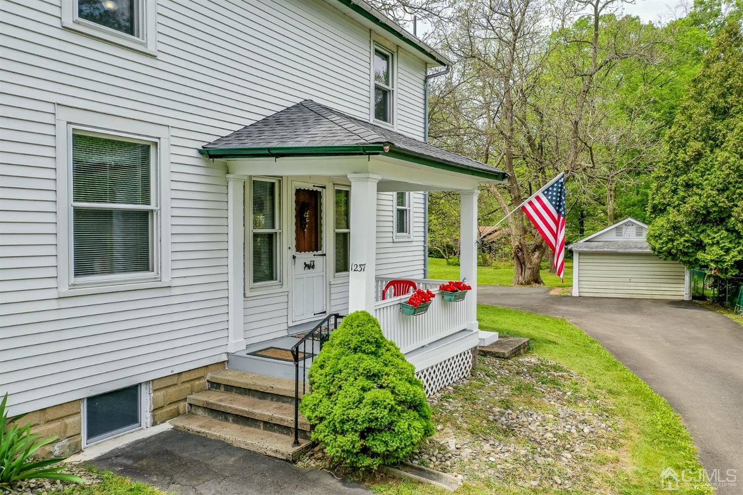 1237 Lower Ferry Road Ewing, NJ 08618 - Photo 39 of 42 a view of a house with a yard and potted plants