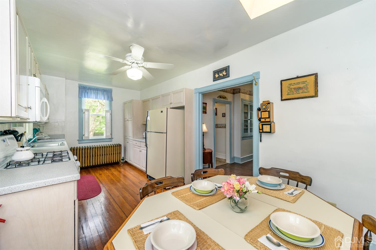 1237 Lower Ferry Road Ewing, NJ 08618 - Photo 6 of 42 a living room with furniture and a dining table