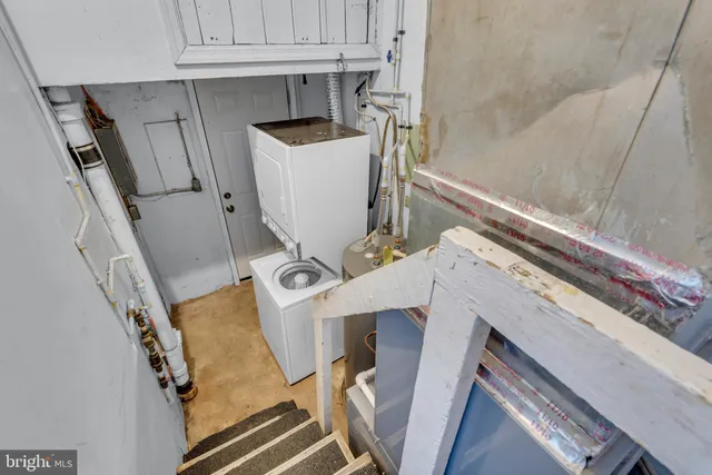 a view of living room with furniture and a fireplace