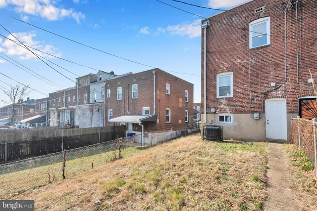 a view of a lake with chairs and covered with snow