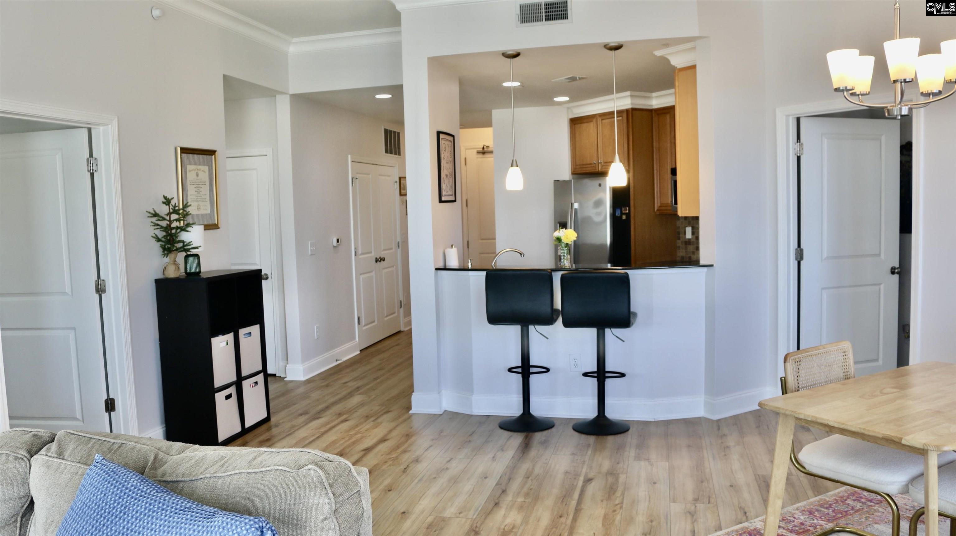 601 Main Street, Unit 323 Columbia, SC 29201 - Photo 18 of 68 a living room with furniture a flat screen tv and a table