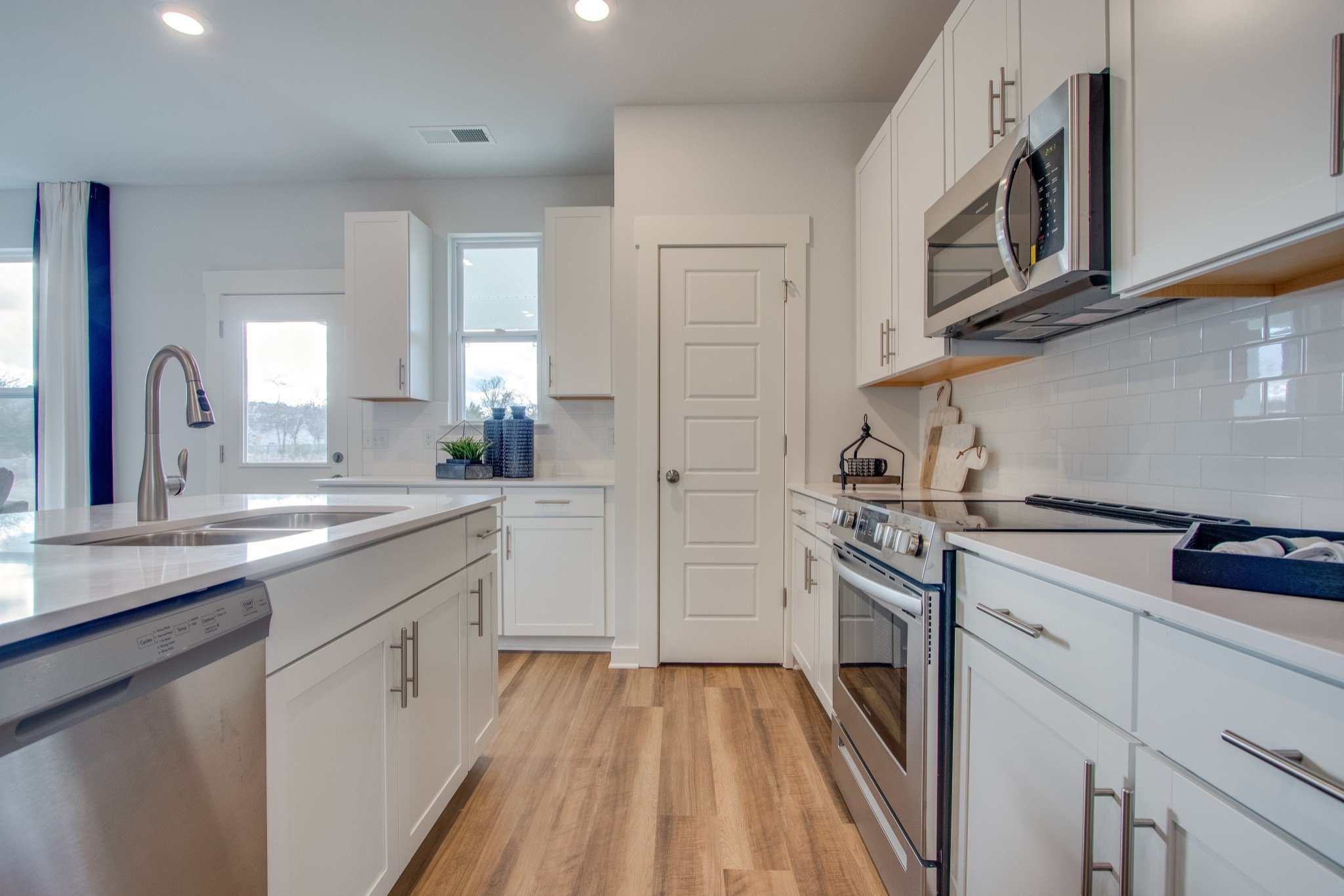 2476 Williams Ridge Drive Columbia, TN 38401 - Photo 5 of 12 a kitchen with stainless steel appliances granite countertop a stove a sink and a refrigerator