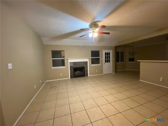 a view of a livingroom with a kitchen