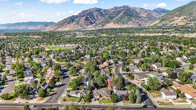 8965 Quail Run Drive Sandy, UT 84093 - Photo 14 of 56 Aerial perspective of suburban area featuring a mountain backdrop