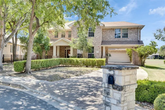 a front view of a house with yard