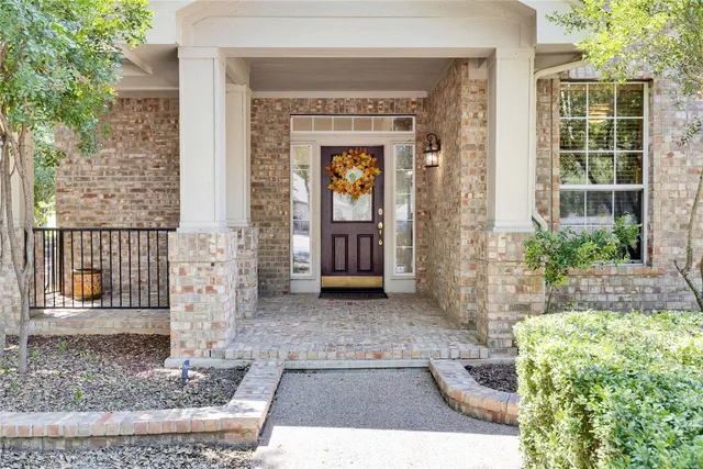 a front view of a house with a porch