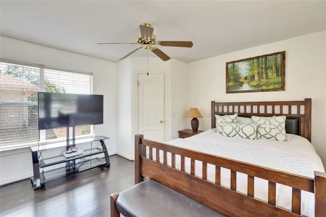 a bedroom with a bed and glass window