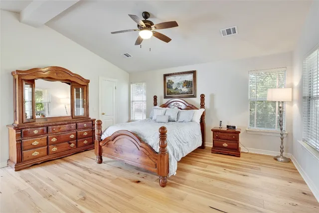 a bedroom with a bed and a dresser