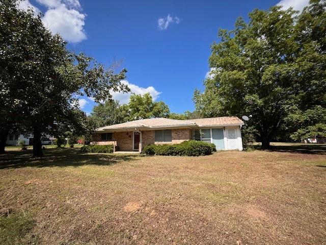 180 Nacogdoches Street Reklaw, TX 75784 - Photo 1 of 1 Ranch-style house featuring the front yard