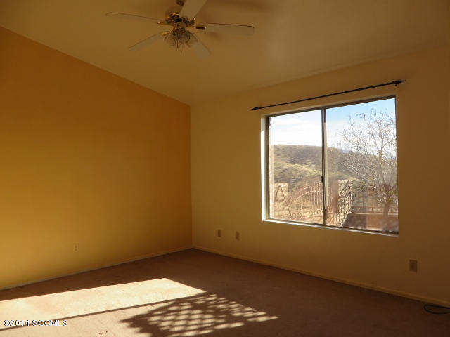 1255 Avenida Gloriosa Rio Rico, AZ 85648 - Photo 12 of 33 a view of an empty room and a window
