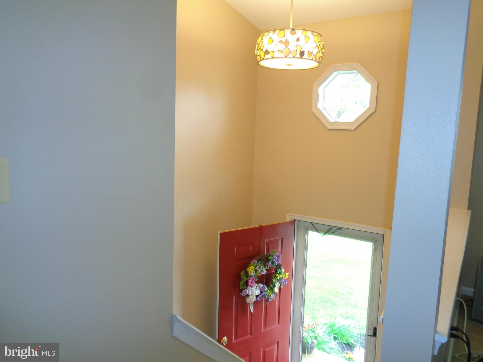 9539 Hallhurst Road Baltimore, MD 21236 - Photo 4 of 24 a view of a chandelier fan and window
