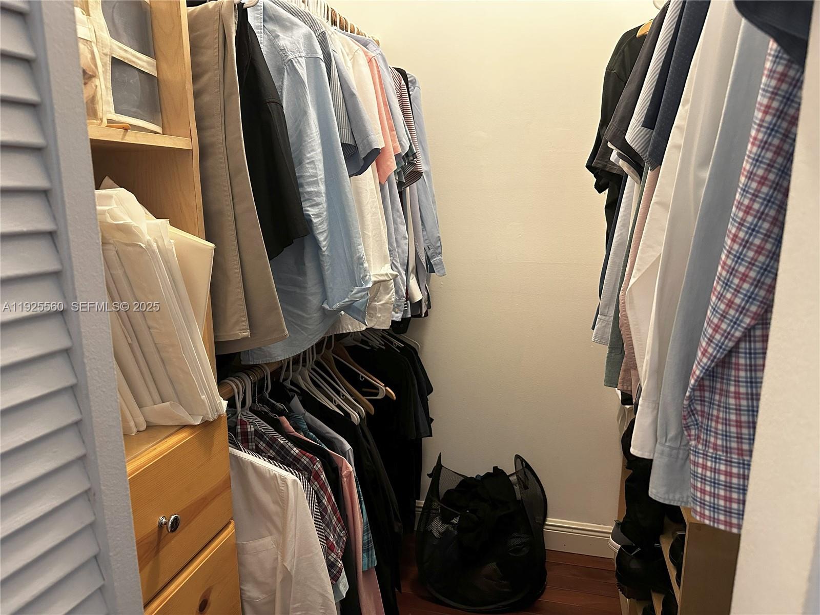 55 Ocean Ln Drive, Unit 4020 Key Biscayne, FL 33149 - Photo 24 of 57 a view of walk in closet with clothes and shoes