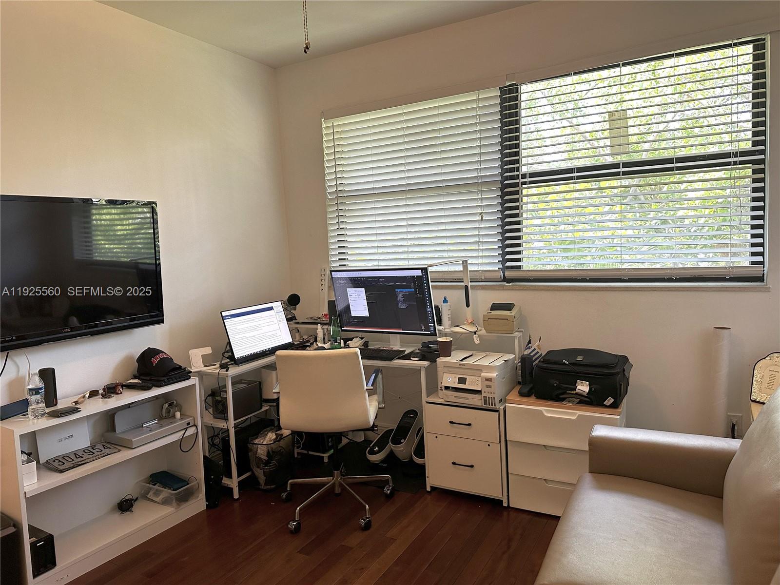 55 Ocean Ln Drive, Unit 4020 Key Biscayne, FL 33149 - Photo 27 of 57 a view of a workspace with furniture and a window