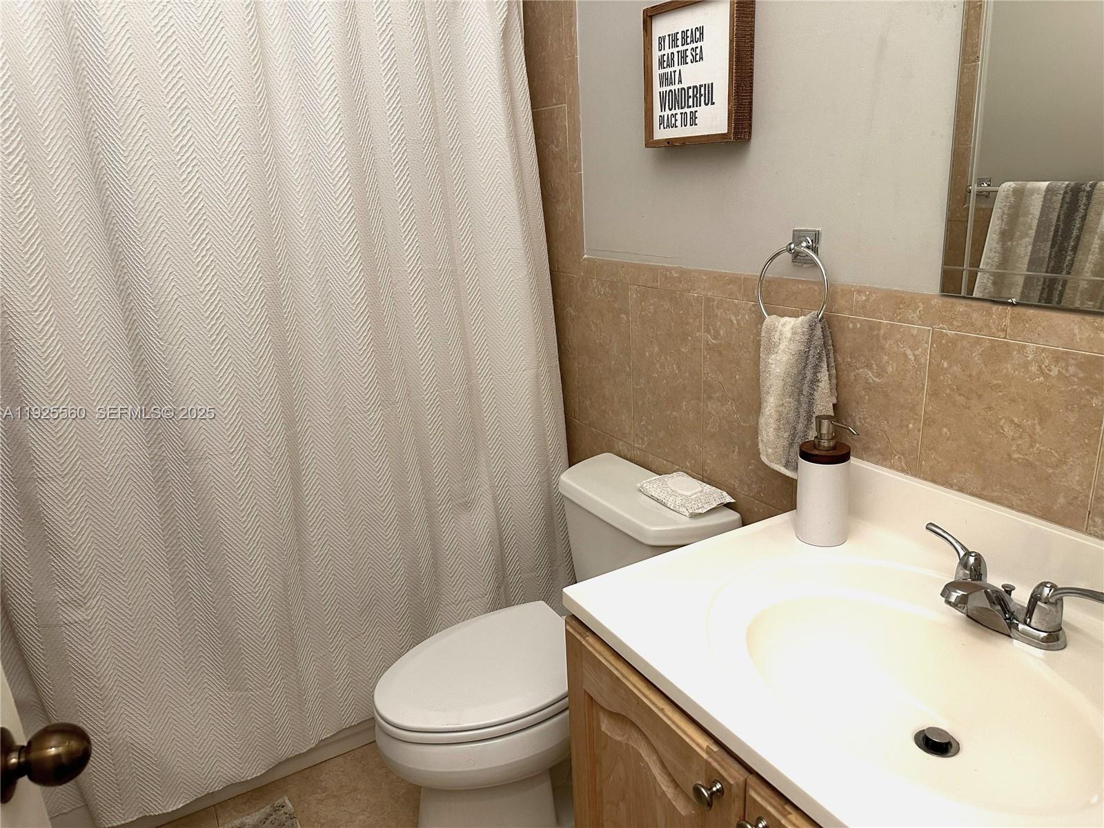 55 Ocean Ln Drive, Unit 4020 Key Biscayne, FL 33149 - Photo 28 of 57 a bathroom with a sink and a toilet