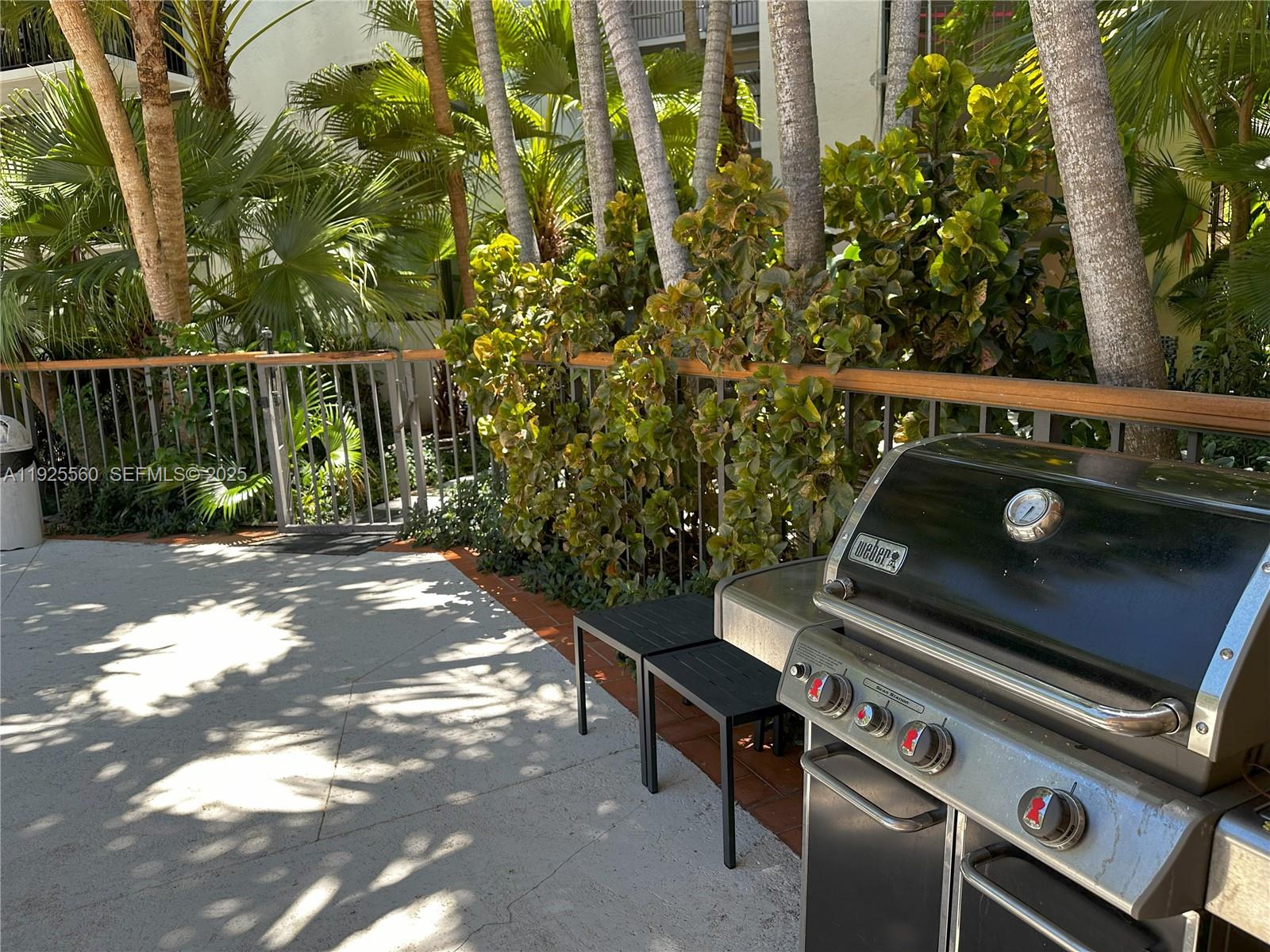 55 Ocean Ln Drive, Unit 4020 Key Biscayne, FL 33149 - Photo 36 of 57 a view of a chairs and table in the patio