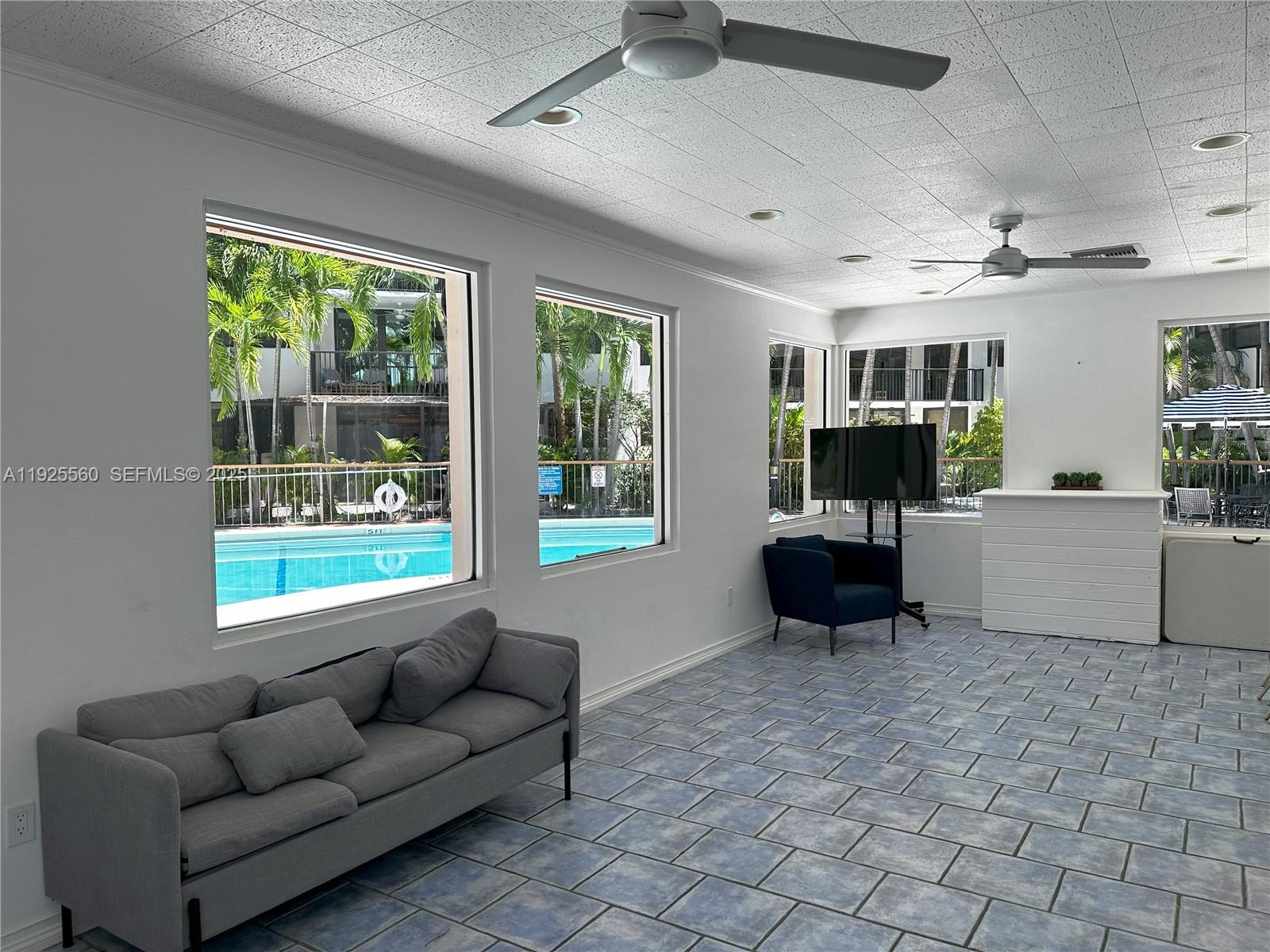 55 Ocean Ln Drive, Unit 4020 Key Biscayne, FL 33149 - Photo 40 of 57 a living room with furniture and a flat screen tv