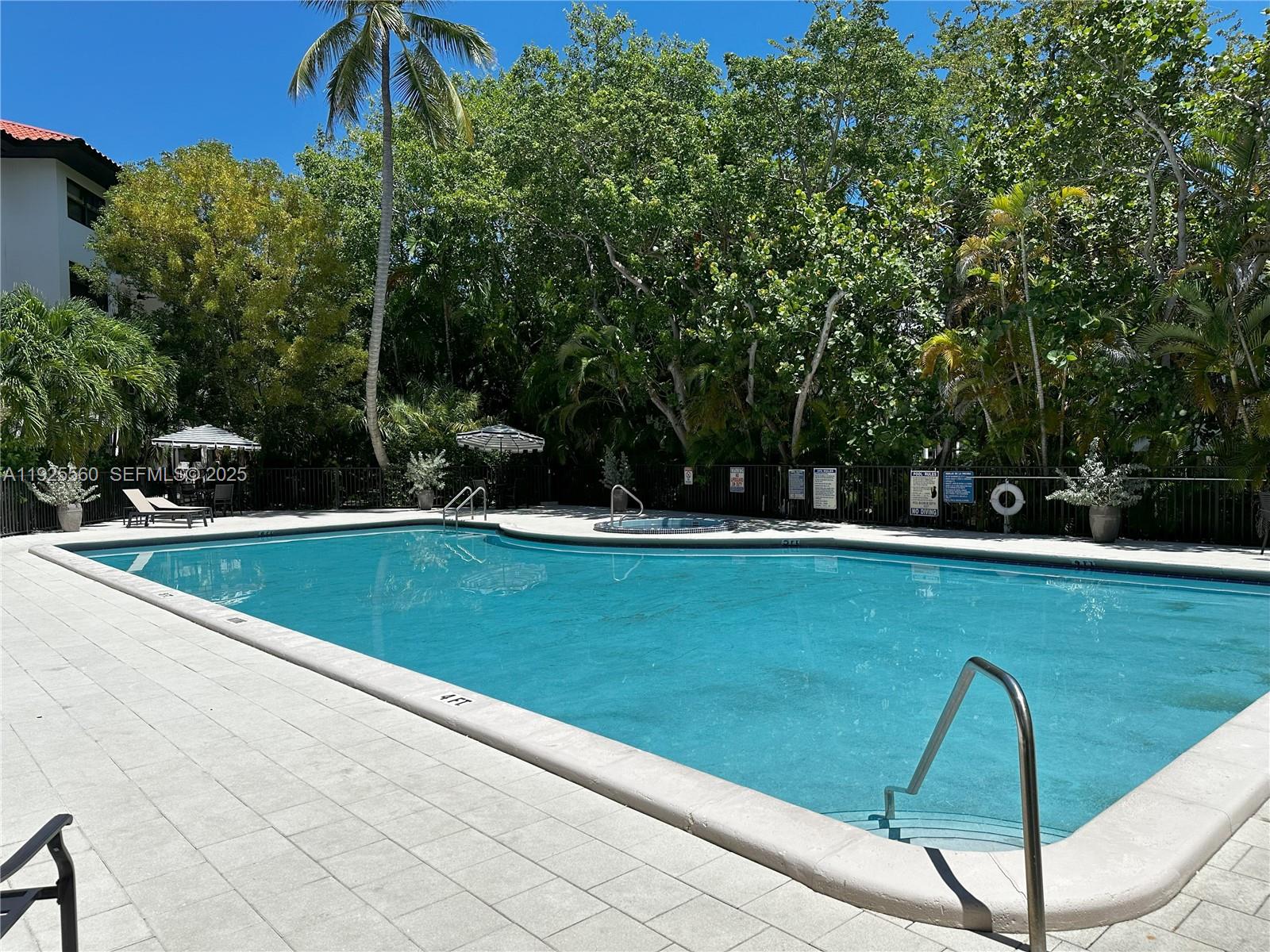 55 Ocean Ln Drive, Unit 4020 Key Biscayne, FL 33149 - Photo 42 of 57 a view of swimming pool from a balcony