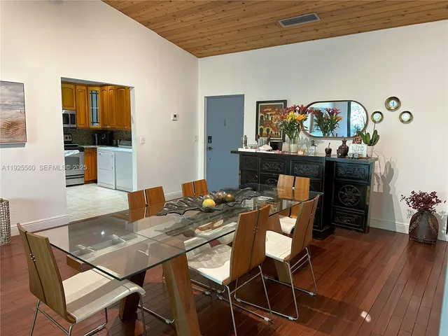 a kitchen with stainless steel appliances granite countertop a refrigerator a stove top oven a sink and dishwasher