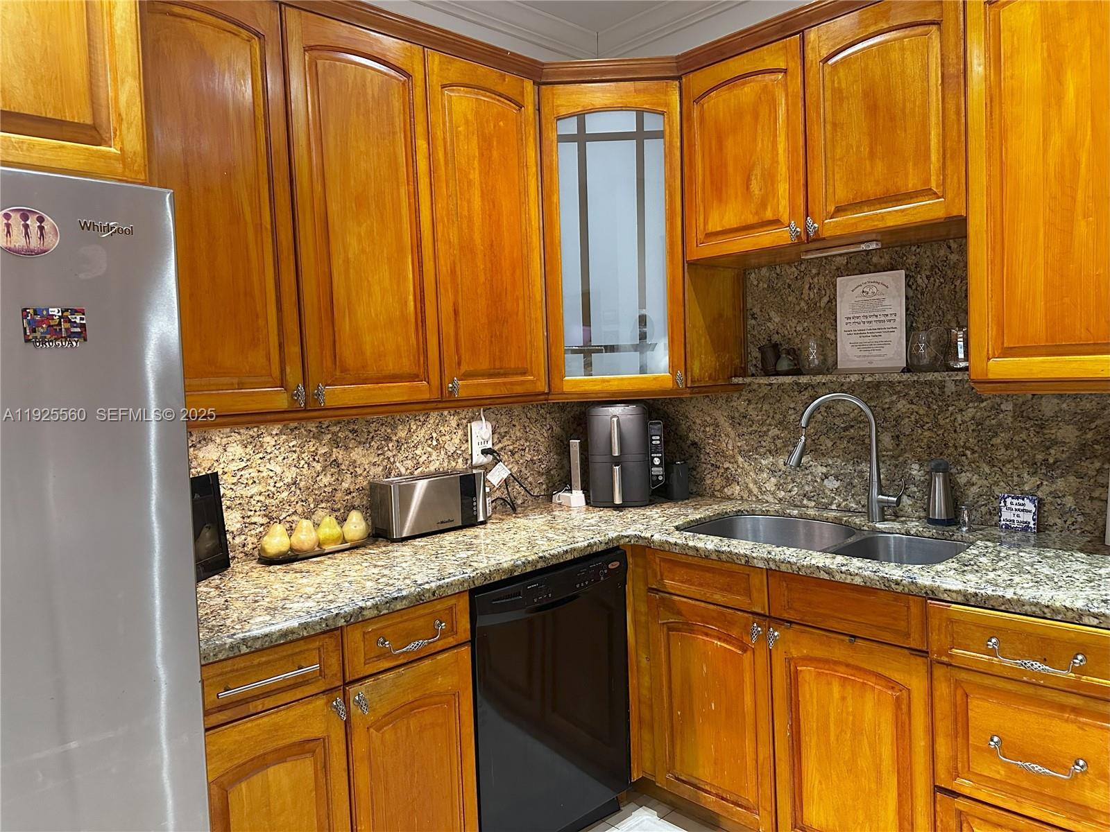 55 Ocean Ln Drive, Unit 4020 Key Biscayne, FL 33149 - Photo 8 of 57 a kitchen with granite countertop stainless steel appliances a sink window and cabinets