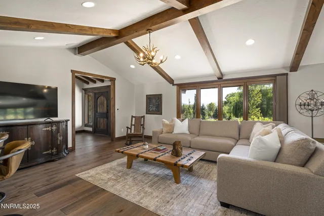 a kitchen with stainless steel appliances granite countertop a refrigerator and a stove