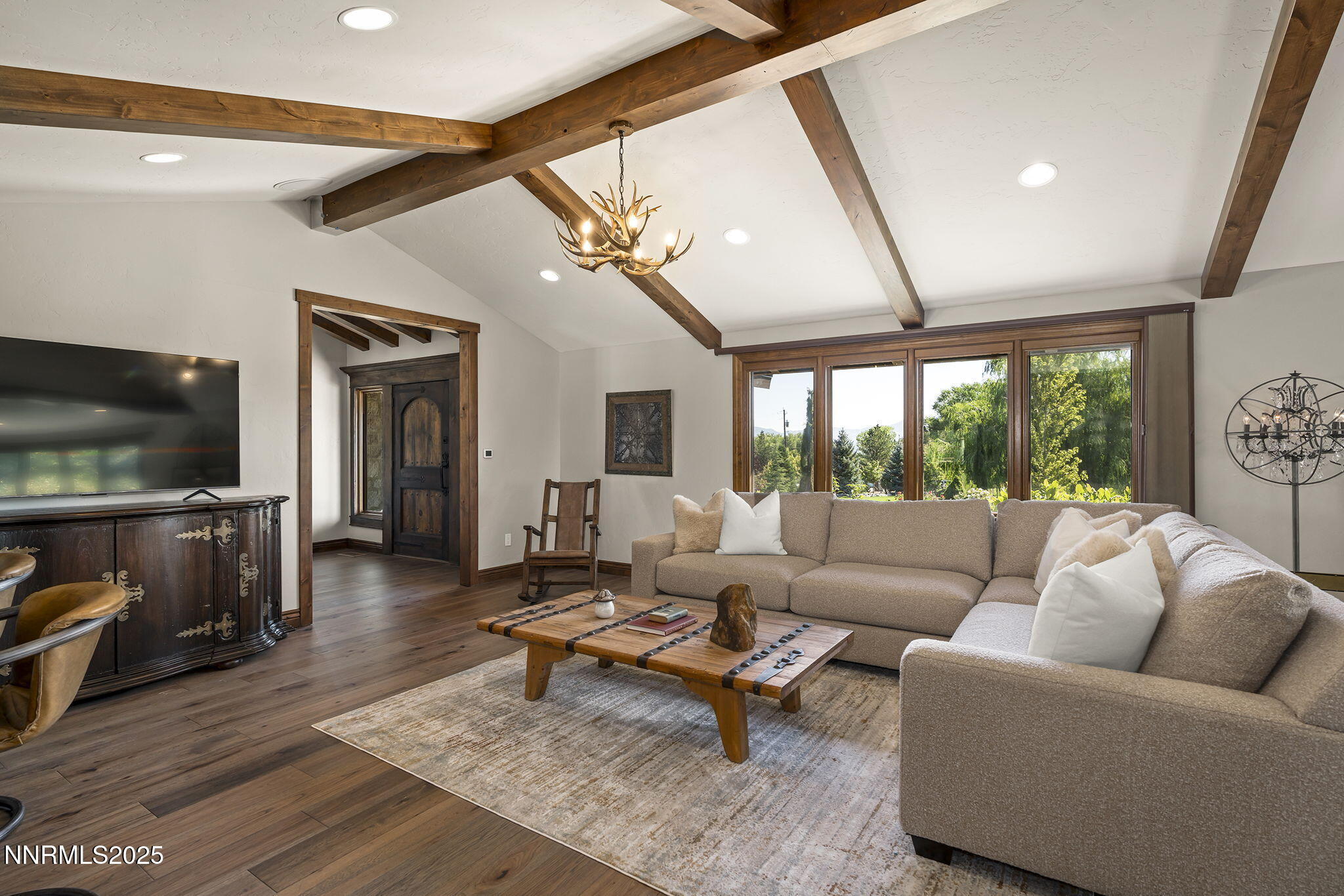 3405 Lone Tree Lane Reno, NV 89511 - Photo 12 of 80 a living room with furniture and a flat screen tv
