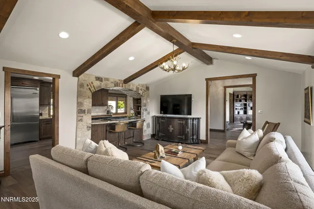 a view of a dining room with furniture wooden floor and chandelier