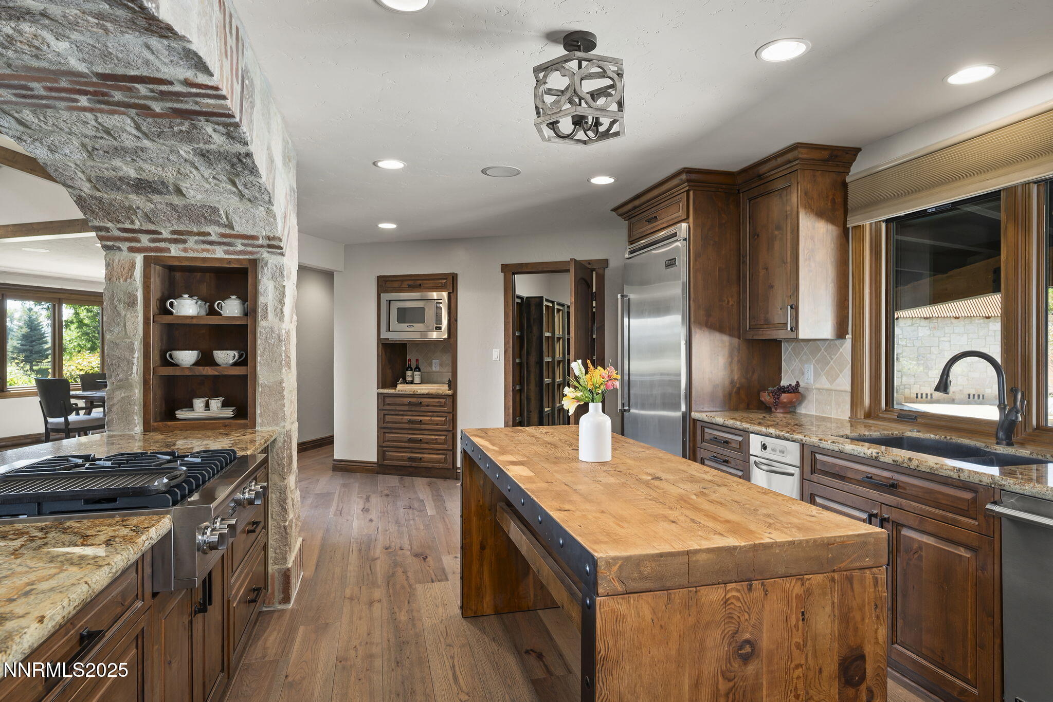 3405 Lone Tree Lane Reno, NV 89511 - Photo 18 of 80 a kitchen with a stove a refrigerator and a stove top oven