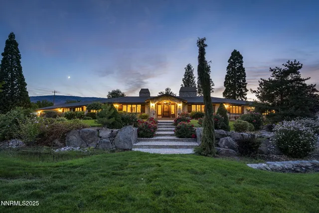 a view of a house with a yard and garage