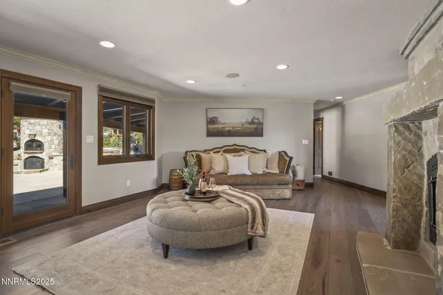 a kitchen with white cabinets and wooden floor