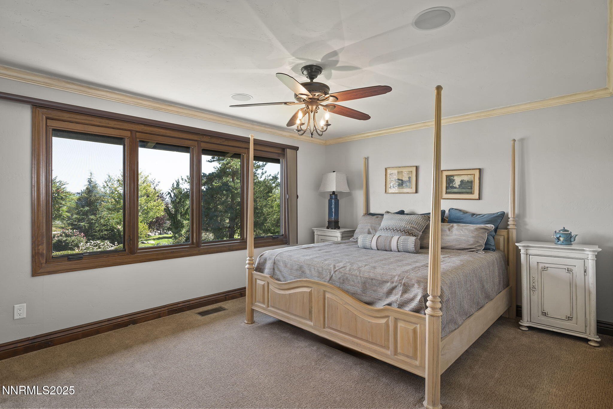 3405 Lone Tree Lane Reno, NV 89511 - Photo 25 of 80 a bed sitting in a bedroom next to a window