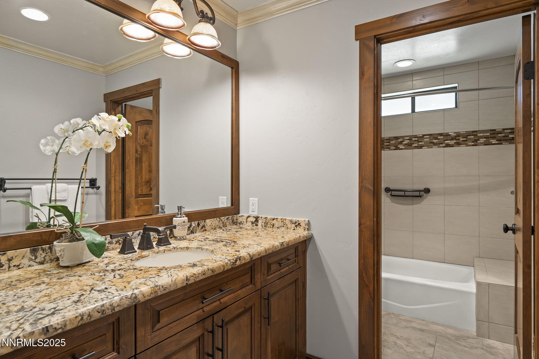 3405 Lone Tree Lane Reno, NV 89511 - Photo 26 of 80 a bathroom with a granite countertop sink and a mirror