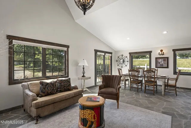 a view of a livingroom with furniture and fire pit