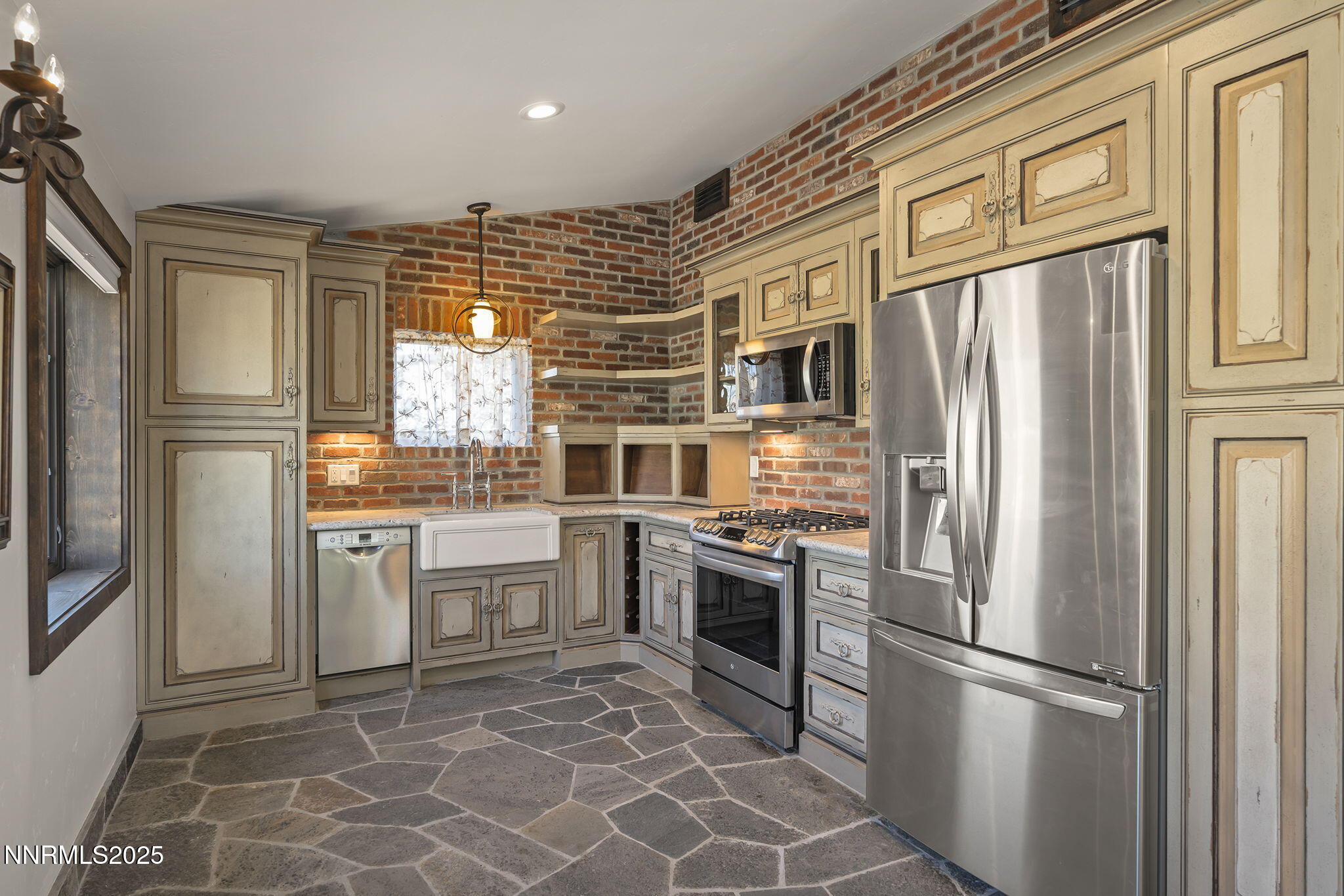3405 Lone Tree Lane Reno, NV 89511 - Photo 43 of 80 a kitchen with stainless steel appliances granite countertop a refrigerator sink and stove