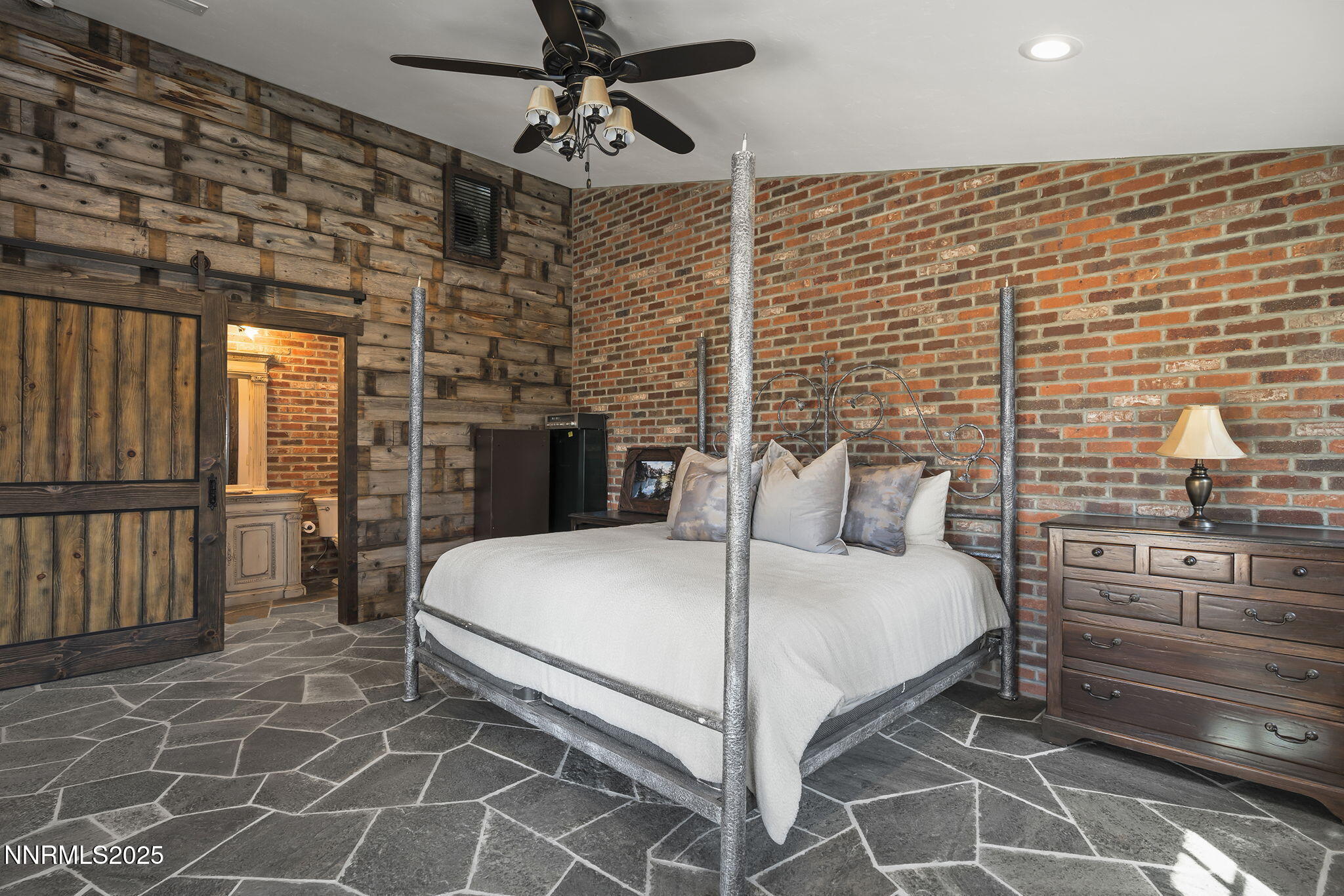 3405 Lone Tree Lane Reno, NV 89511 - Photo 45 of 80 a bedroom with a bed and a flat screen tv