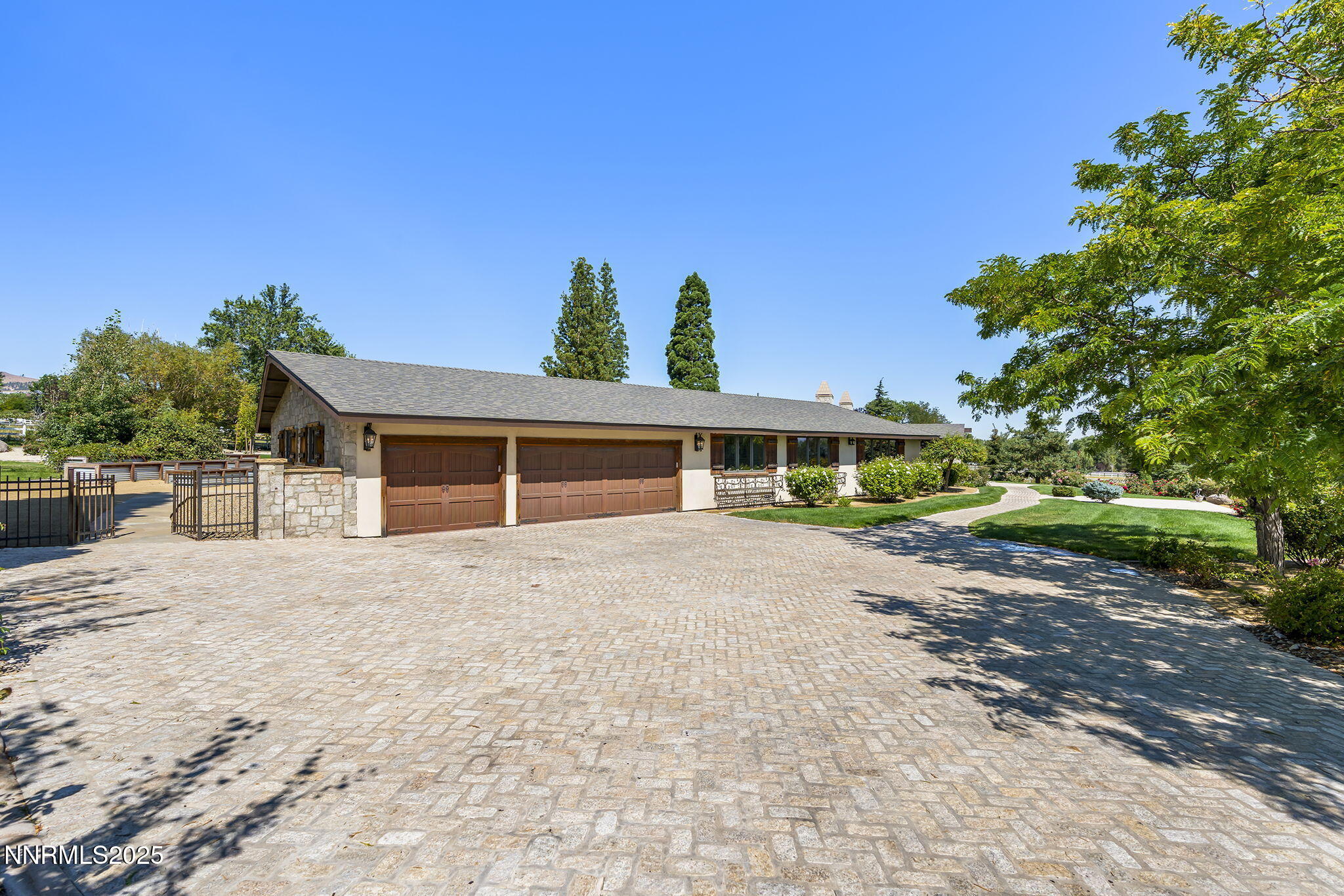 3405 Lone Tree Lane Reno, NV 89511 - Photo 6 of 80 a front view of a house with a yard and garage
