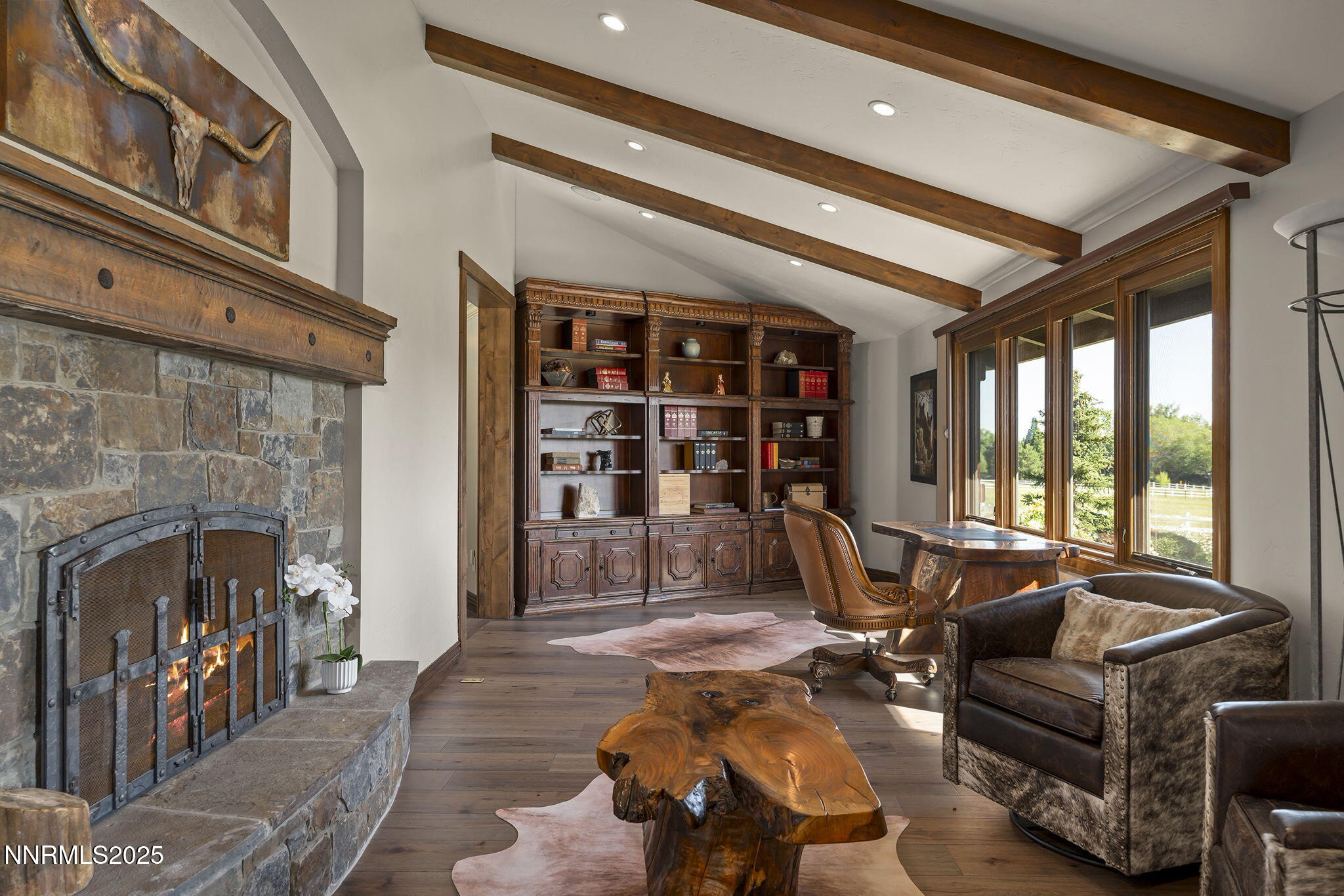 3405 Lone Tree Lane Reno, NV 89511 - Photo 8 of 80 a living room with furniture a fireplace and a large window